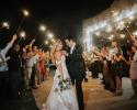 A gorgeous wedding exit caught with the guests holding sparklers.